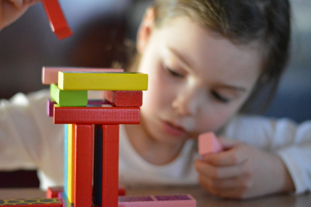 Open-ended toys like building blocks allow your child to develop creativity and help her become a better learner